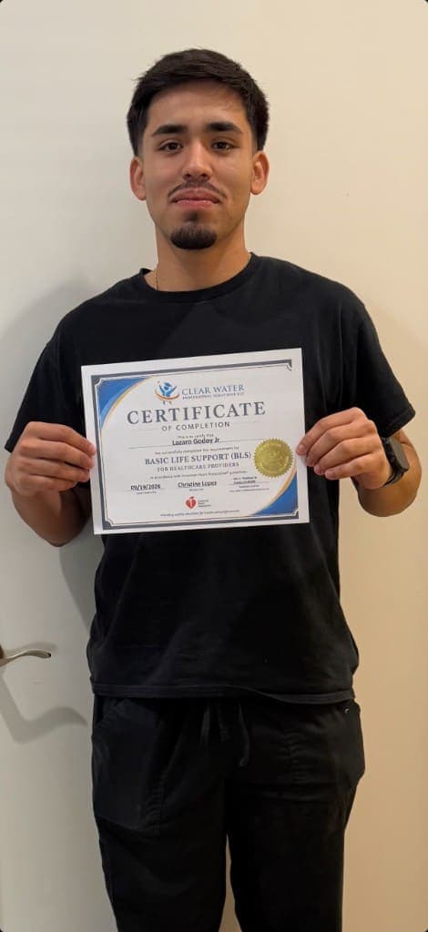 Clear Water graduate holding a Basic Life Support for Healthcare Providers certificate